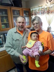 Scott and Stephanie with a grandchild 2014